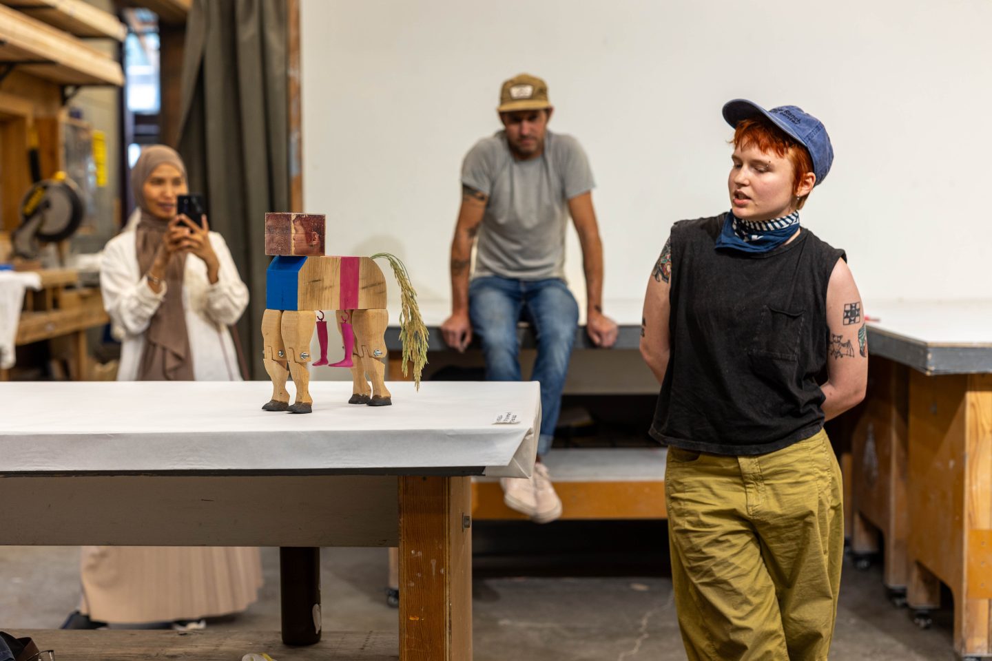 artist presenting and discussing a wood sculpture in a studio at Anderson Ranch Arts Center