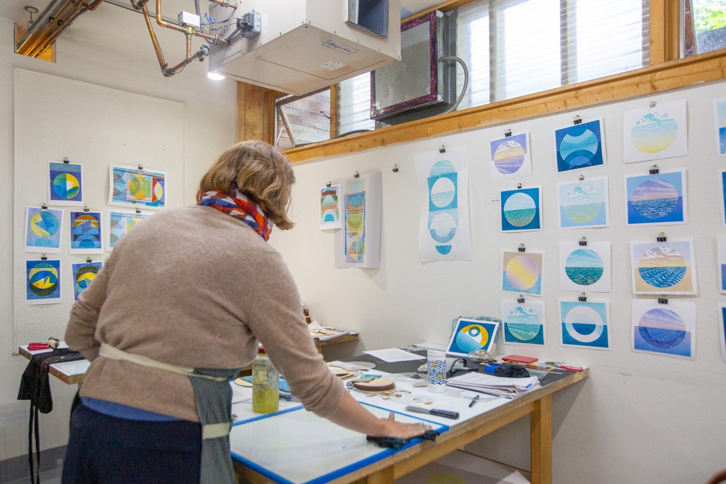 artists working at printmaking presses in a studio environment at Anderson Ranch