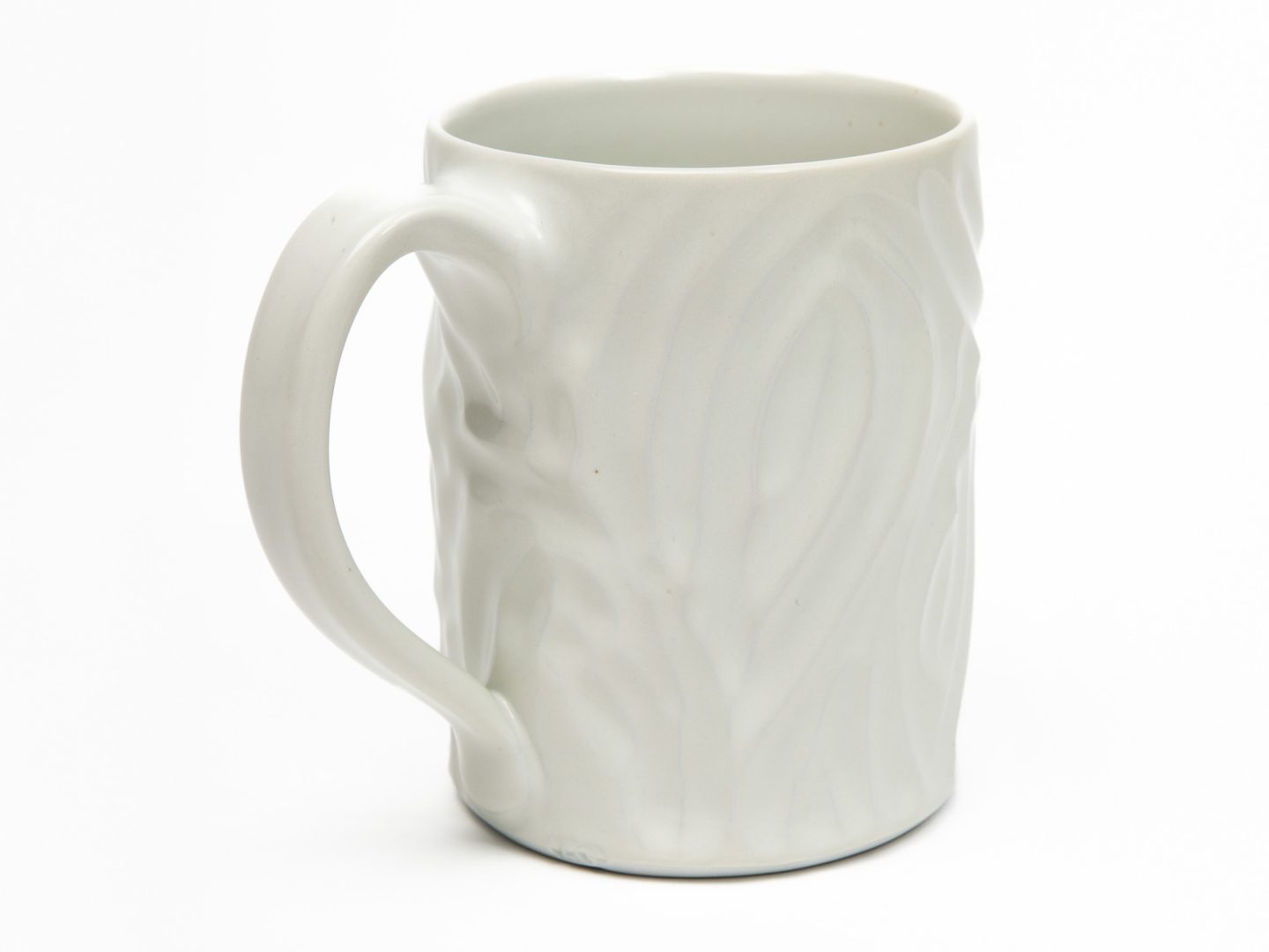 adult student practicing basic wheel throwing techniques