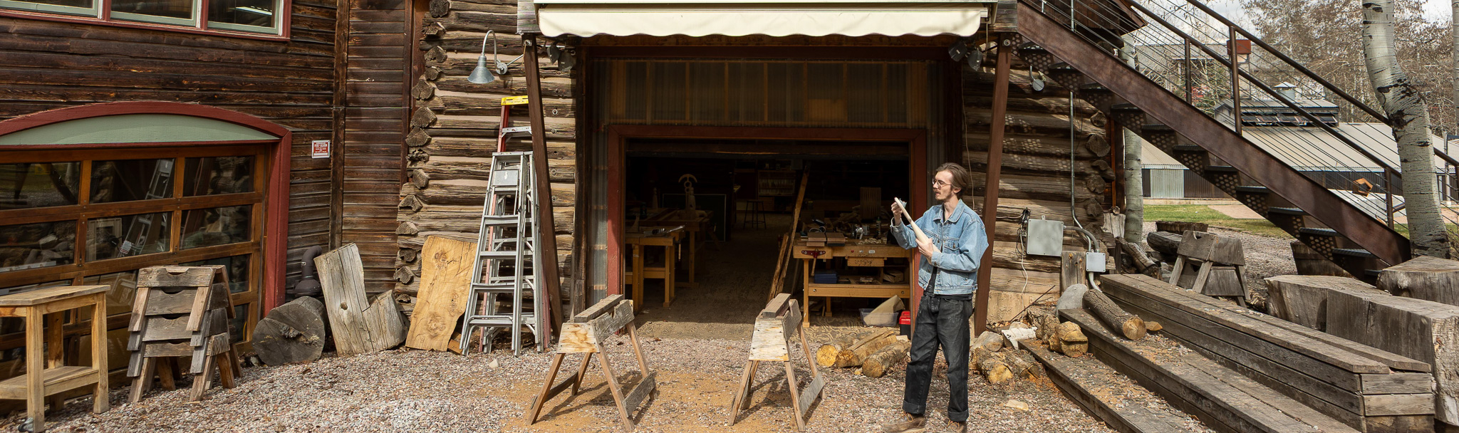 woodworking studio at Anderson Ranch Arts Center with students shaping wood furniture using hand and power tools