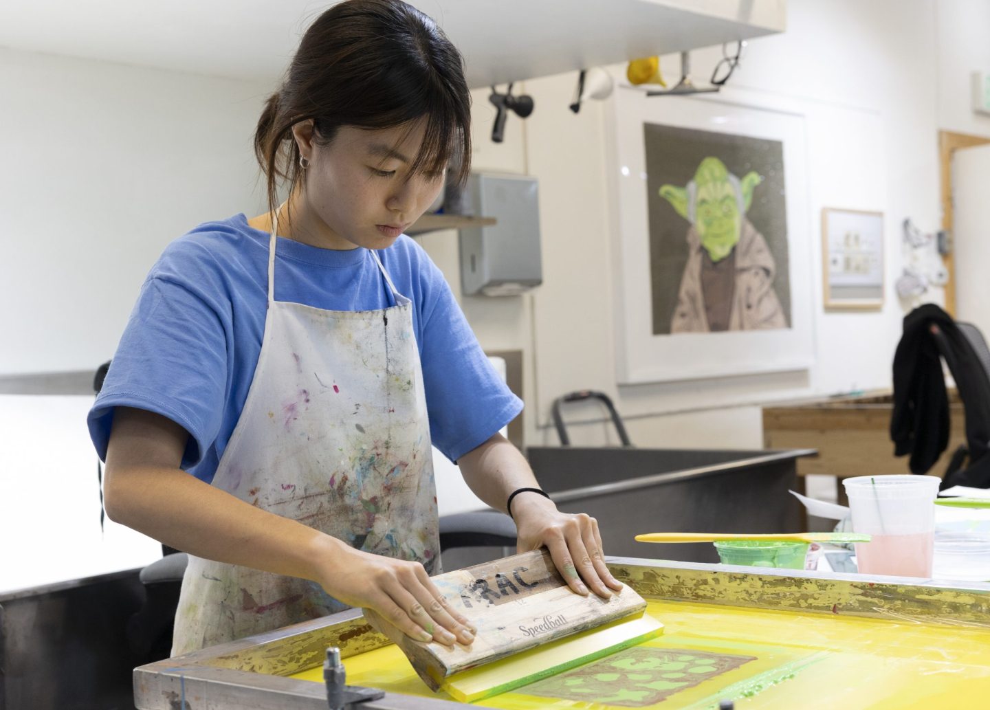 Teen screen printing class introducing beginner screen printing skills, stencils, and printed poster editions