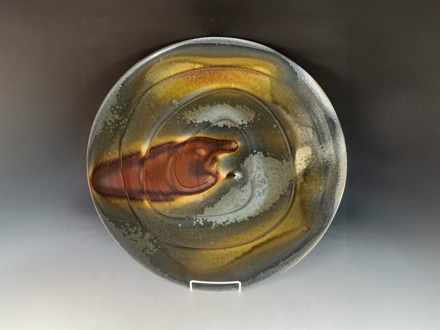 wood-fired kiln process showing ash and flame effects on ceramic surfaces