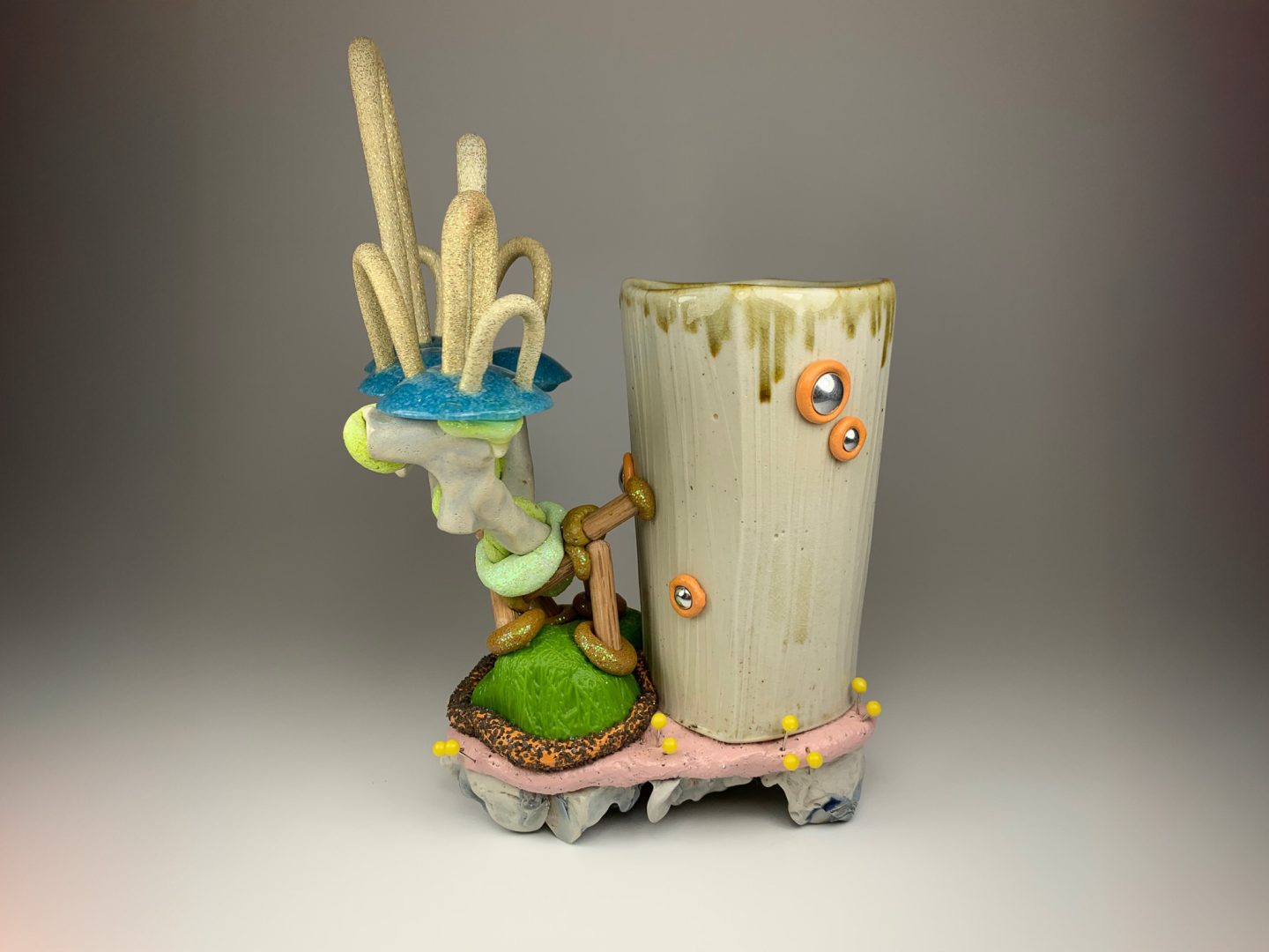 mixed media ceramic work combining clay with found and alternative materials