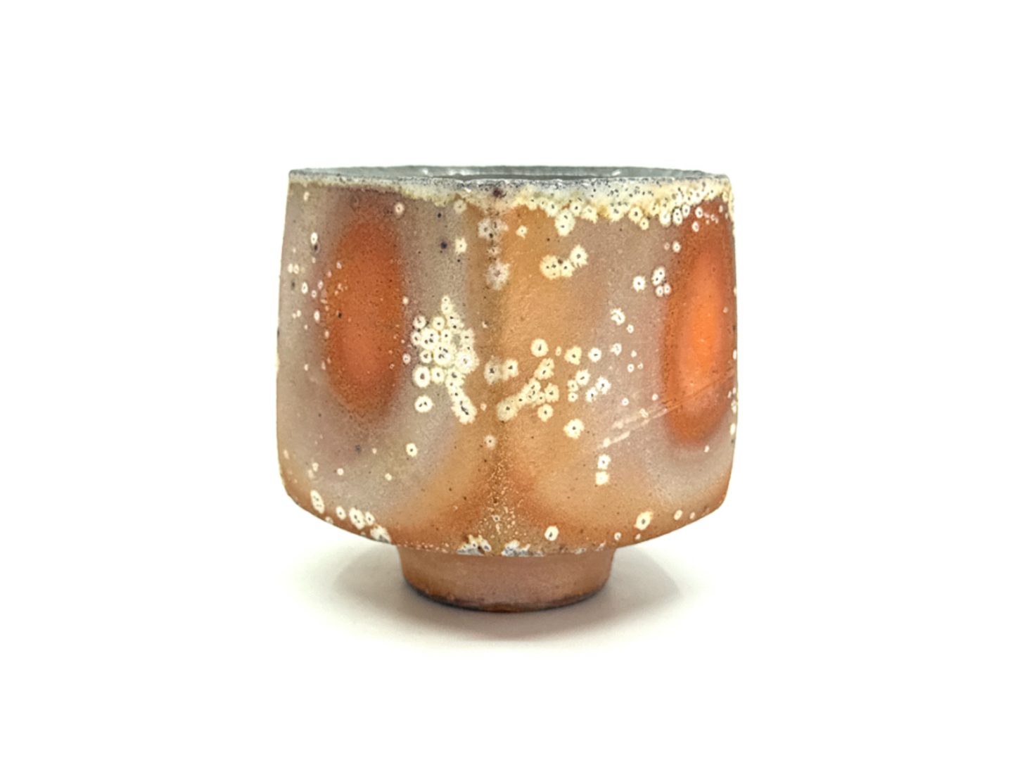 altered wheel-thrown ceramic forms prepared for soda firing